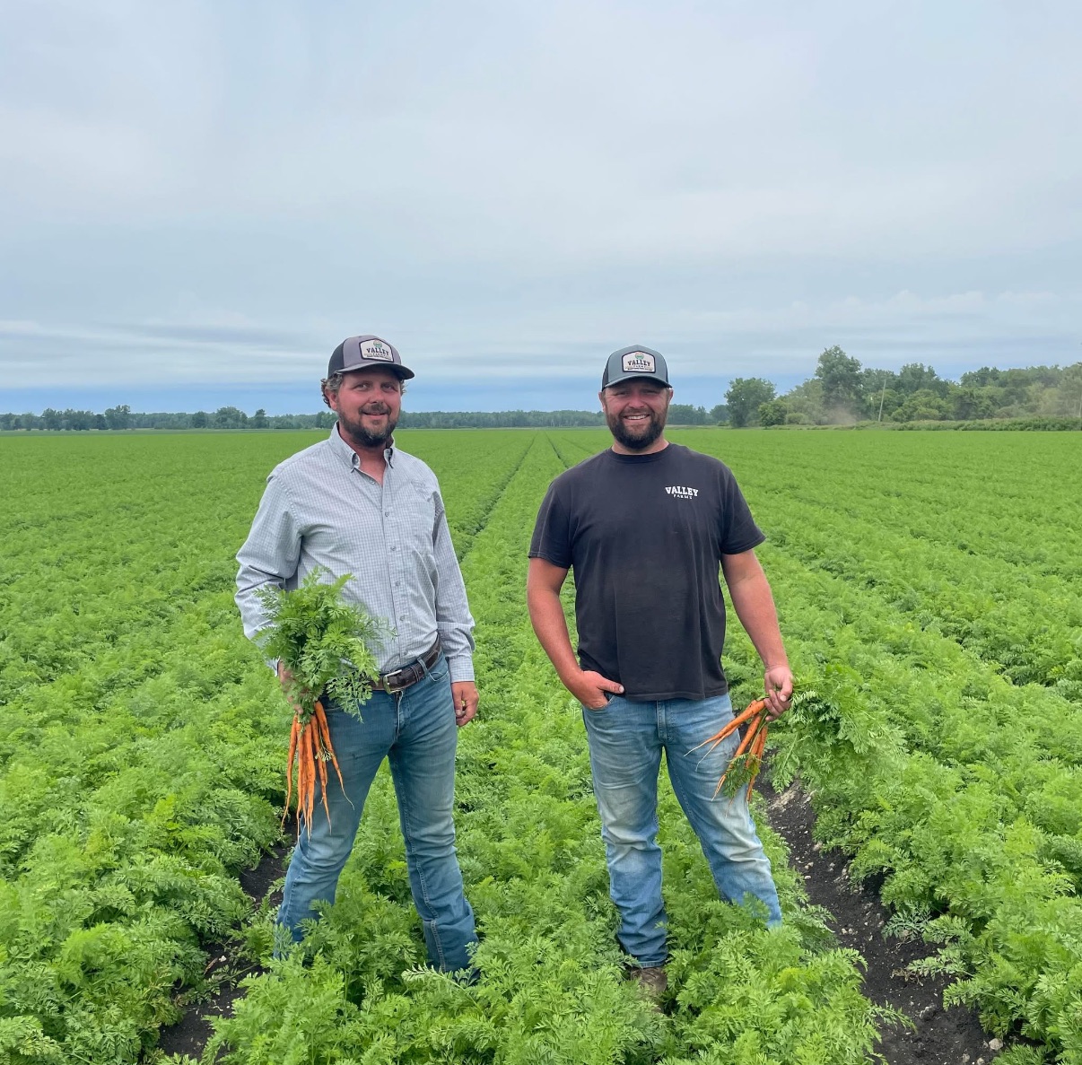 Craig and Chris Brandt out standing in their field